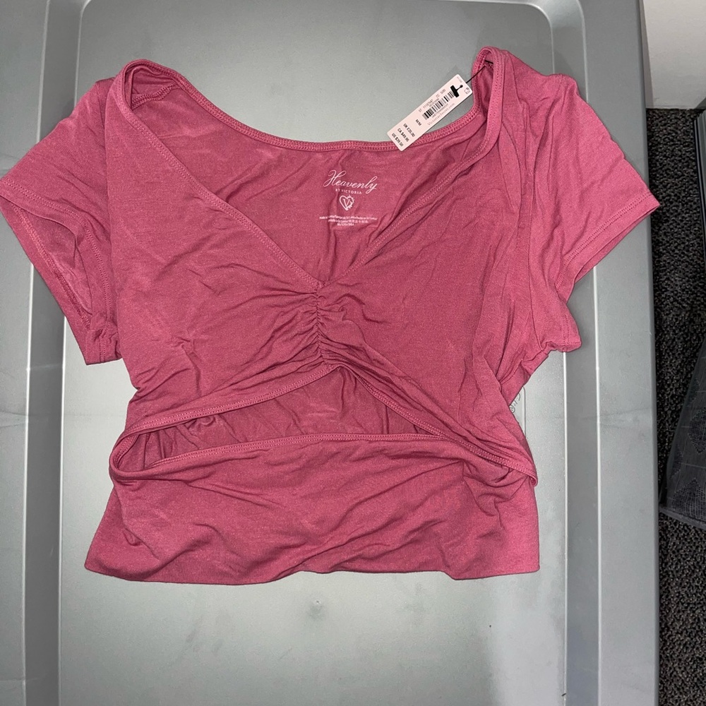 Pink shirt with cut out in stomach area